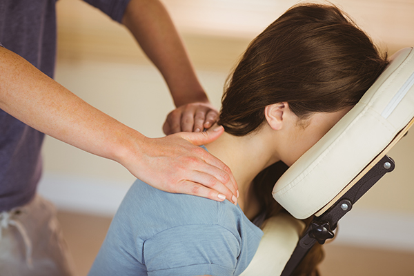 person in chair massage getting a massage