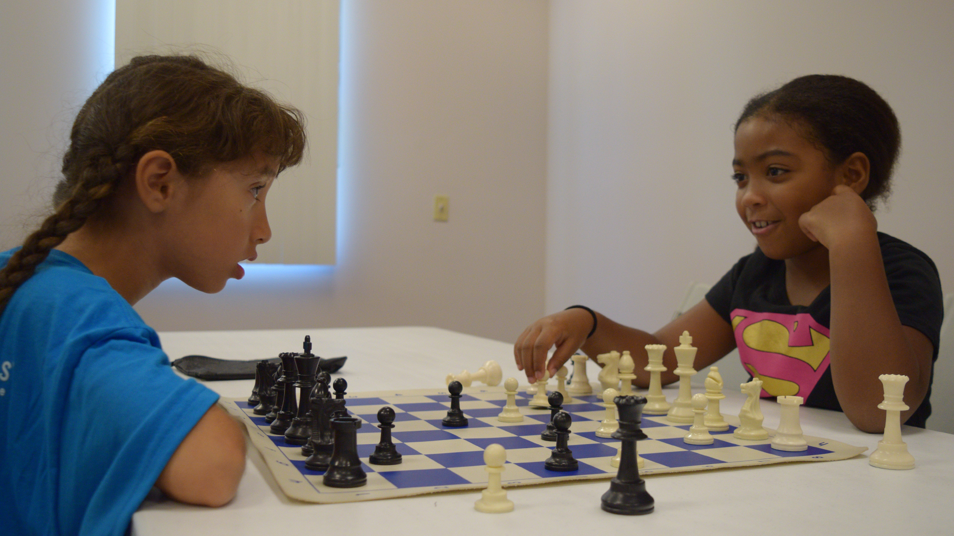 A group of fifth graders engaged in a game of chess or cheered on their  friends playing following Friday's afternoon movie. #stlukesct…