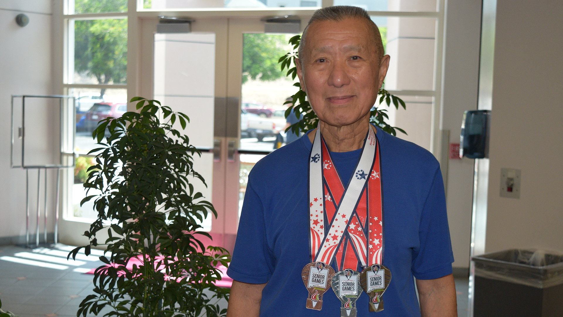 James Ho and his three medals