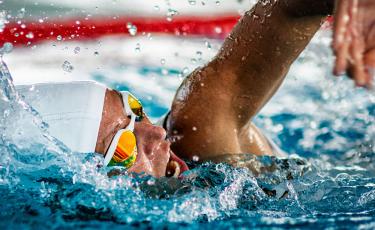 person swimming in swimming pool