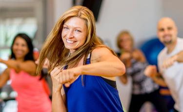 woman in blue working out in dance class
