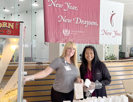 Lori and Kim serving popcorn
