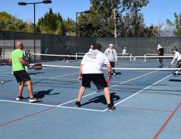 Pickleball players compete.